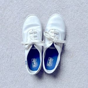 Little girls white Keds sneakers